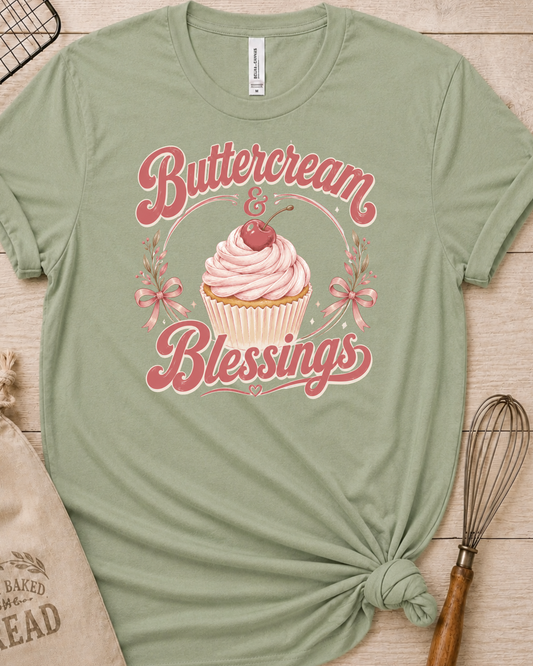 Sage green women's relaxed fit t-shirt reading Buttercream and Blessings with a frosted cupcake and a delicate bow.