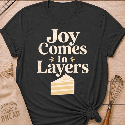 Dark Heather Grey Joy Comes in Layers women's relaxed fit tee with playful vintage lettering and a layered slice of cake