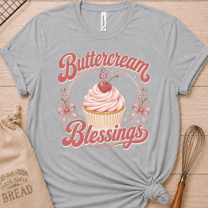Athletic heather women's relaxed fit t-shirt reading Buttercream and Blessings with a frosted cupcake illustration.