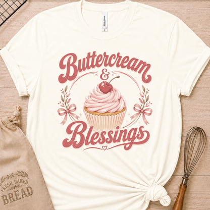Vintage white women's relaxed fit t-shirt reading Buttercream and Blessings with a frosted cupcake illustration.