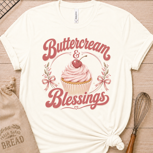 Vintage white women's relaxed fit t-shirt reading Buttercream and Blessings with a frosted cupcake illustration.