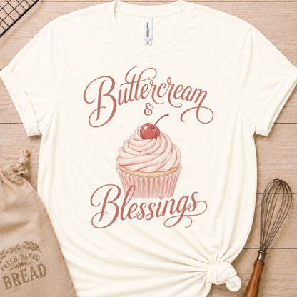 Vintage white women's relaxed fit t-shirt reading Buttercream and Blessings with a frosted cupcake and a delicate bow.