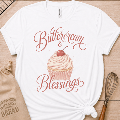 White women's relaxed fit t-shirt reading Buttercream and Blessings with a frosted cupcake and a delicate bow.