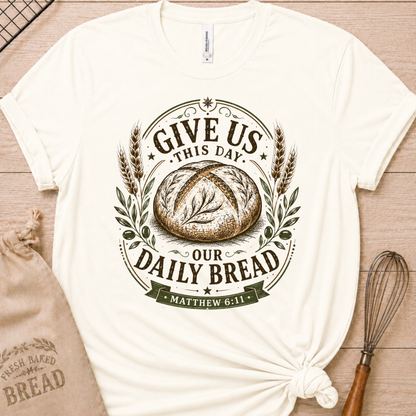 Vintage white women's relaxed fit t-shirt with the Daily Bread emblem, a clean badge-style bread illustration inspired by Matthew 6:11.