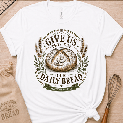 White women's relaxed fit t-shirt with the Daily Bread emblem, a clean badge-style bread illustration inspired by Matthew 6:11.