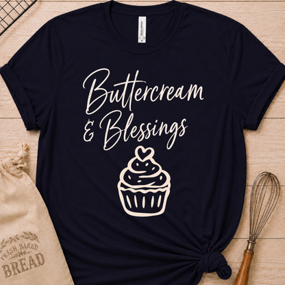 Navy women's relaxed fit t-shirt with Buttercream and Blessings in flowing script above a cupcake topped with a heart.
