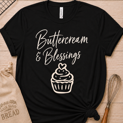 Black women's relaxed fit t-shirt with Buttercream and Blessings in flowing script above a cupcake topped with a heart.