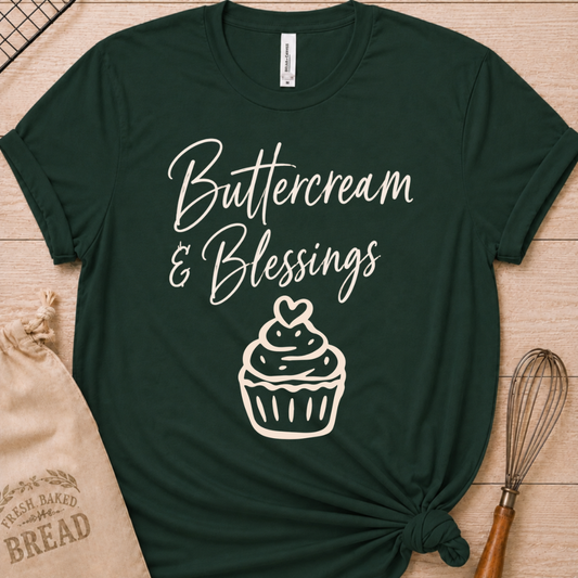 Forest green women's relaxed fit t-shirt with Buttercream and Blessings in flowing script above a cupcake topped with a heart.