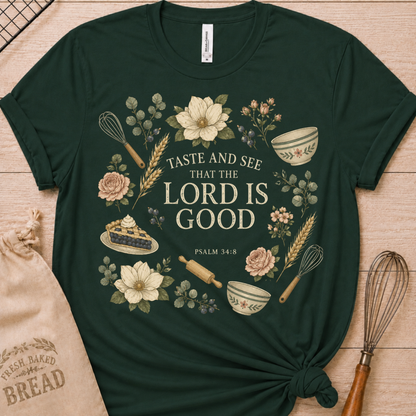 Forest green women's relaxed fit t-shirt with Taste and See from Psalm 34:8 inside a soft botanical wreath.