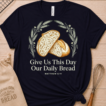 Navy women's relaxed fit t-shirt with the Daily Bread design featuring two rustic half loaves side by side, inspired by Matthew 6:11.