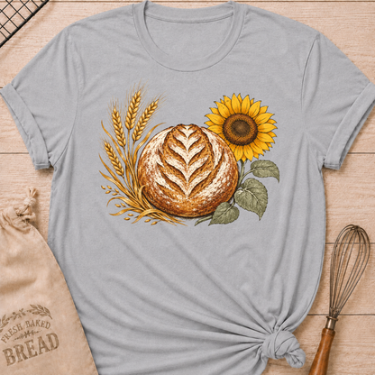 Athletic Heather Bread, Wheat and Sunflower women's relaxed fit tee with a hand-scored artisan loaf, golden wheat, and a sunflower