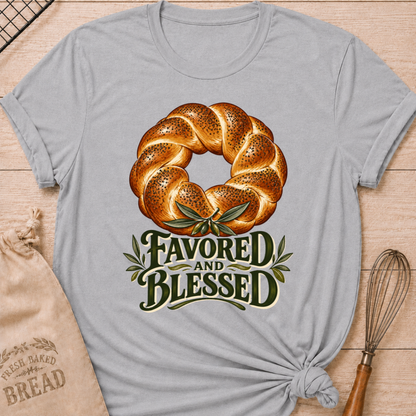Athletic Heather women's relaxed fit tee with a braided loaf accented with olive branches and bold vintage Favored and Blessed lettering in deep earthy tones