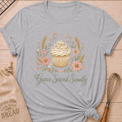 Athletic heather women's relaxed fit t-shirt with a frosted cupcake framed by soft pink flowers, wheat and greenery.