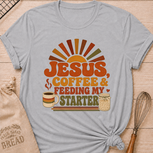 Athletic heather women's relaxed fit t-shirt with the words Jesus, Coffee & Feeding My Starter in bold retro lettering with a steaming mug and a sourdough starter jar.