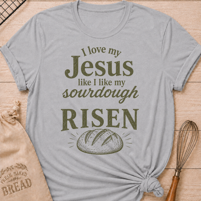 Athletic heather women's relaxed fit t-shirt with the words I Love My Jesus Like I Like My Sourdough, Risen in bold vintage lettering and a rustic loaf of bread.
