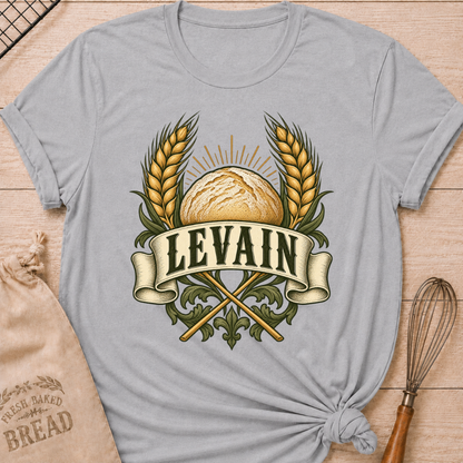 Athletic Heather women's relaxed fit tee with a rustic loaf between golden wheat and radiant accents, with Levain lettering on an old-world banner