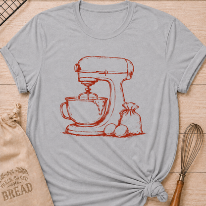 Athletic heather women's relaxed fit t-shirt with a vintage stand mixer, a flour sack and fresh eggs in a single color sketch.