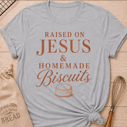 Athletic Heather Raised On Jesus and Homemade Biscuits women's relaxed fit tee with warm vintage typography and a classic biscuit