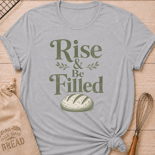 Athletic heather women's relaxed fit t-shirt with the words Rise and Be Filled in vintage lettering above a rustic loaf of bread and leafy accents.