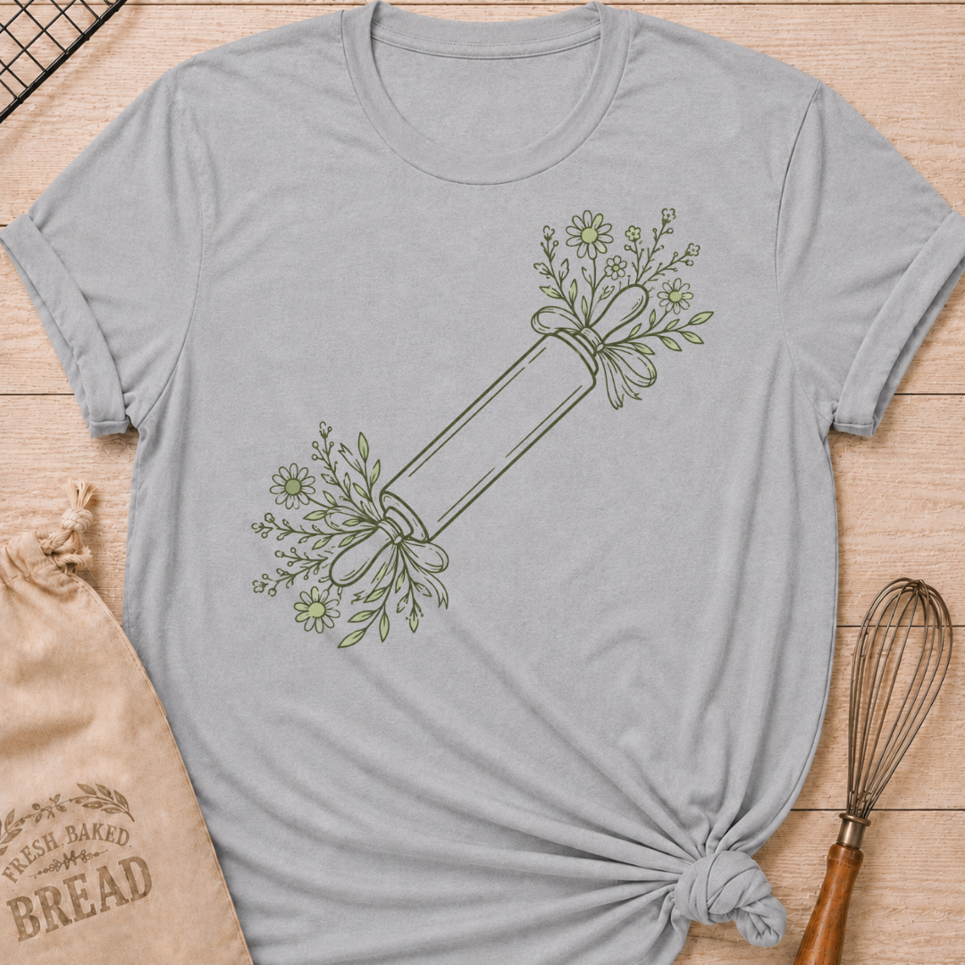 Athletic heather women's relaxed fit t-shirt with a rolling pin dressed in soft floral sprigs and bows.
