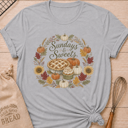Athletic Heather women's relaxed fit tee with Sundays and Sweets lettering in a vintage harvest wreath of pumpkins, sunflowers, wheat and colorful fall leaves around a lattice pie and frosted cupcake