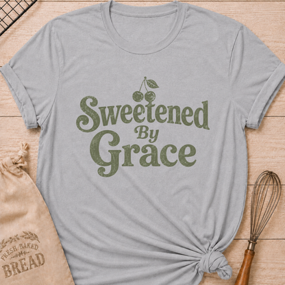 Athletic heather women's relaxed fit t-shirt with the words Sweetened by Grace in playful vintage lettering and a cherry.