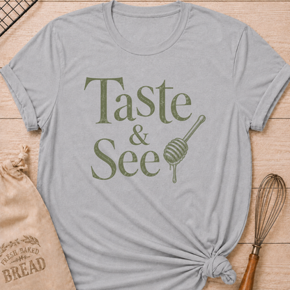 Athletic heather women's relaxed fit t-shirt with the words Taste and See in vintage lettering and a dripping honey dipper.