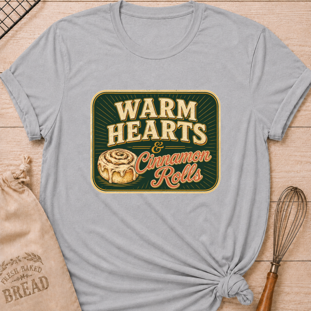Athletic heather women's relaxed fit t-shirt with the words Warm Hearts & Cinnamon Rolls in bold vintage lettering with a gooey iced cinnamon roll in a retro sign style.