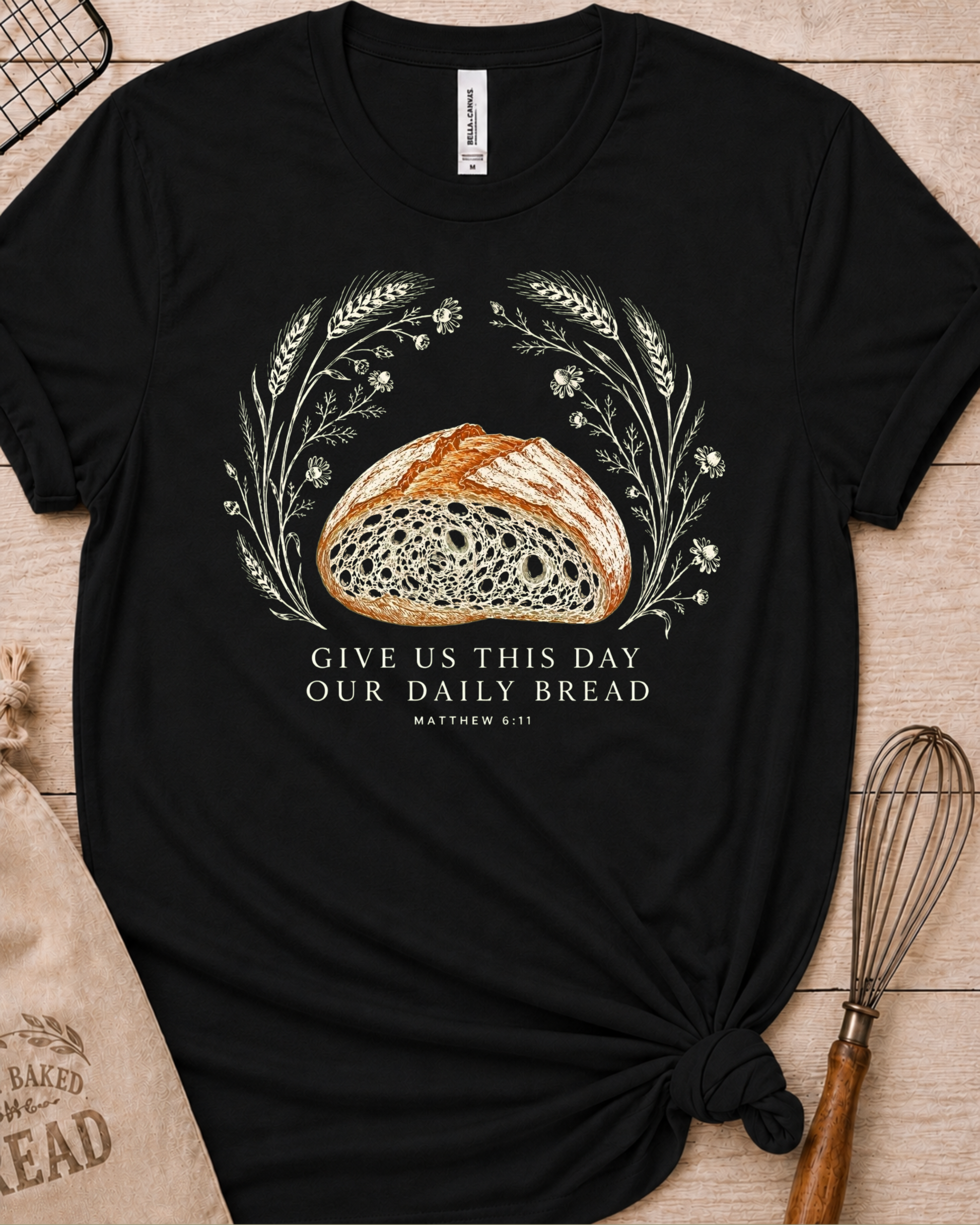 Black women's relaxed fit t-shirt with the Daily Bread design featuring a rustic half loaf of bread, inspired by Matthew 6:11.