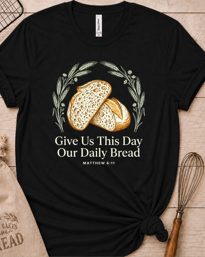 Black women's relaxed fit t-shirt with the Daily Bread design featuring two rustic half loaves side by side, inspired by Matthew 6:11.