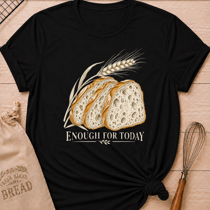 Black women's relaxed fit tee with three rustic slices of artisan bread and a graceful stalk of wheat in a warm vintage style, with Enough for Today lettering