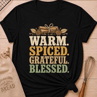 Black women's relaxed fit tee with bold vintage Warm Spiced Grateful Blessed lettering, cinnamon sticks, star anise and cloves in a fall palette