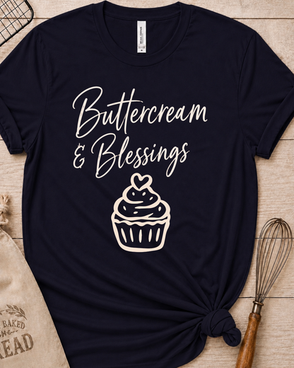 Navy women's relaxed fit t-shirt with Buttercream and Blessings in flowing script above a cupcake topped with a heart.