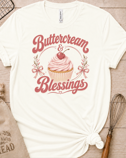 Vintage white women's relaxed fit t-shirt reading Buttercream and Blessings with a frosted cupcake and a delicate bow.