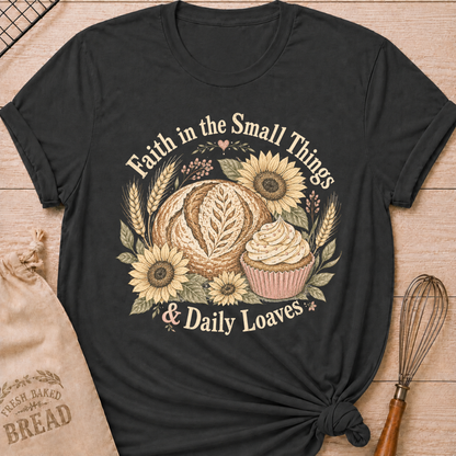 Dark Heather Grey Faith In The Small Things women's relaxed fit tee with artisan bread, a frosted cupcake, sunflowers, and wheat