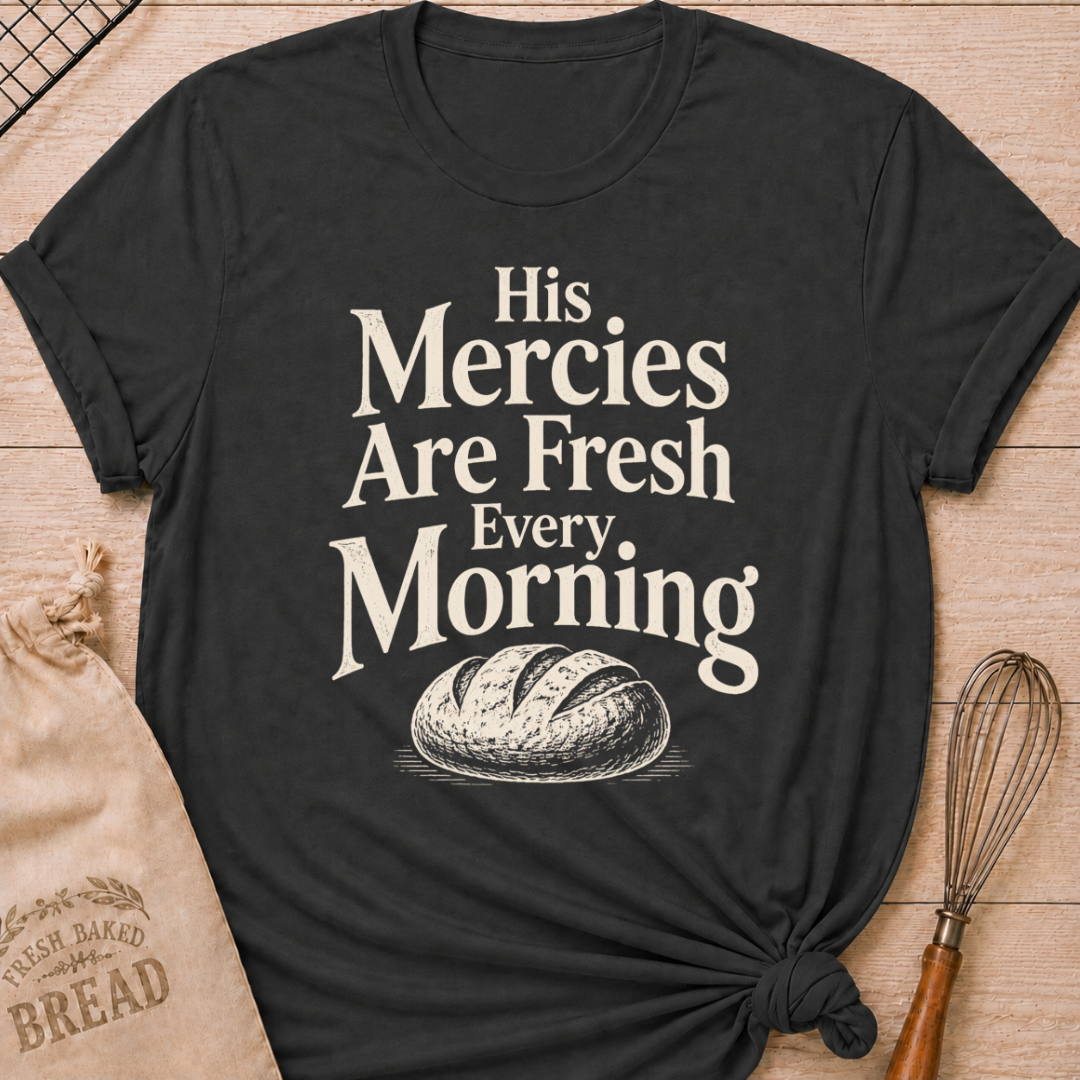 Dark heather grey women's relaxed fit t-shirt with the words His Mercies Are Fresh Every Morning above a rustic loaf of bread.