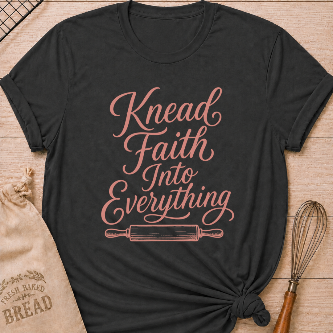 Dark heather grey women's relaxed fit t-shirt with Knead Faith Into Everything in graceful script and a classic rolling pin.