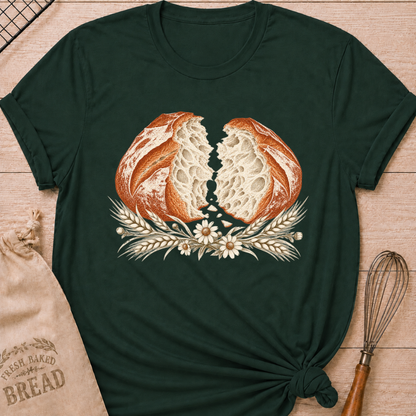 Forest Green women's relaxed fit tee with a torn artisan loaf showing its airy crumb, framed by wheat and delicate wildflowers