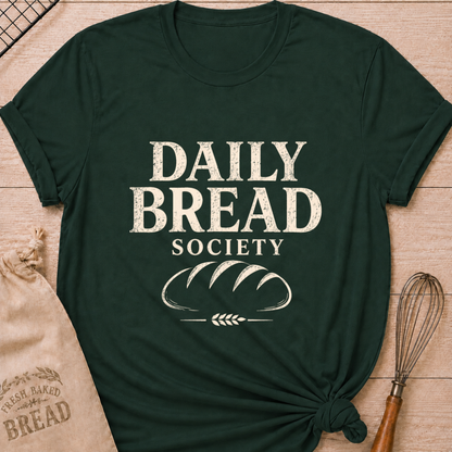Forest green women's relaxed fit t-shirt with the words Daily Bread Society in bold vintage lettering above a classic loaf and wheat.