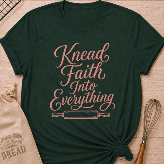 Forest green women's relaxed fit t-shirt with Knead Faith Into Everything in graceful script and a classic rolling pin.
