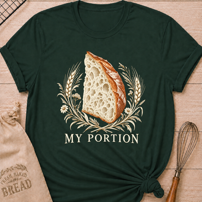 Forest Green women's relaxed fit tee with a detailed slice of artisan bread framed by wheat and delicate wildflowers in warm earthy tones, with My Portion lettering below
