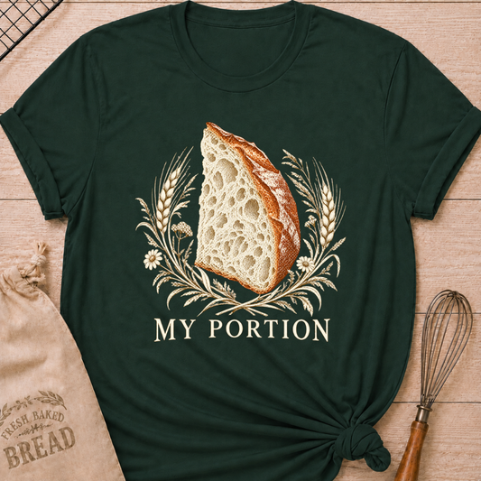 Forest Green women's relaxed fit tee with a detailed slice of artisan bread framed by wheat and delicate wildflowers in warm earthy tones, with My Portion lettering below