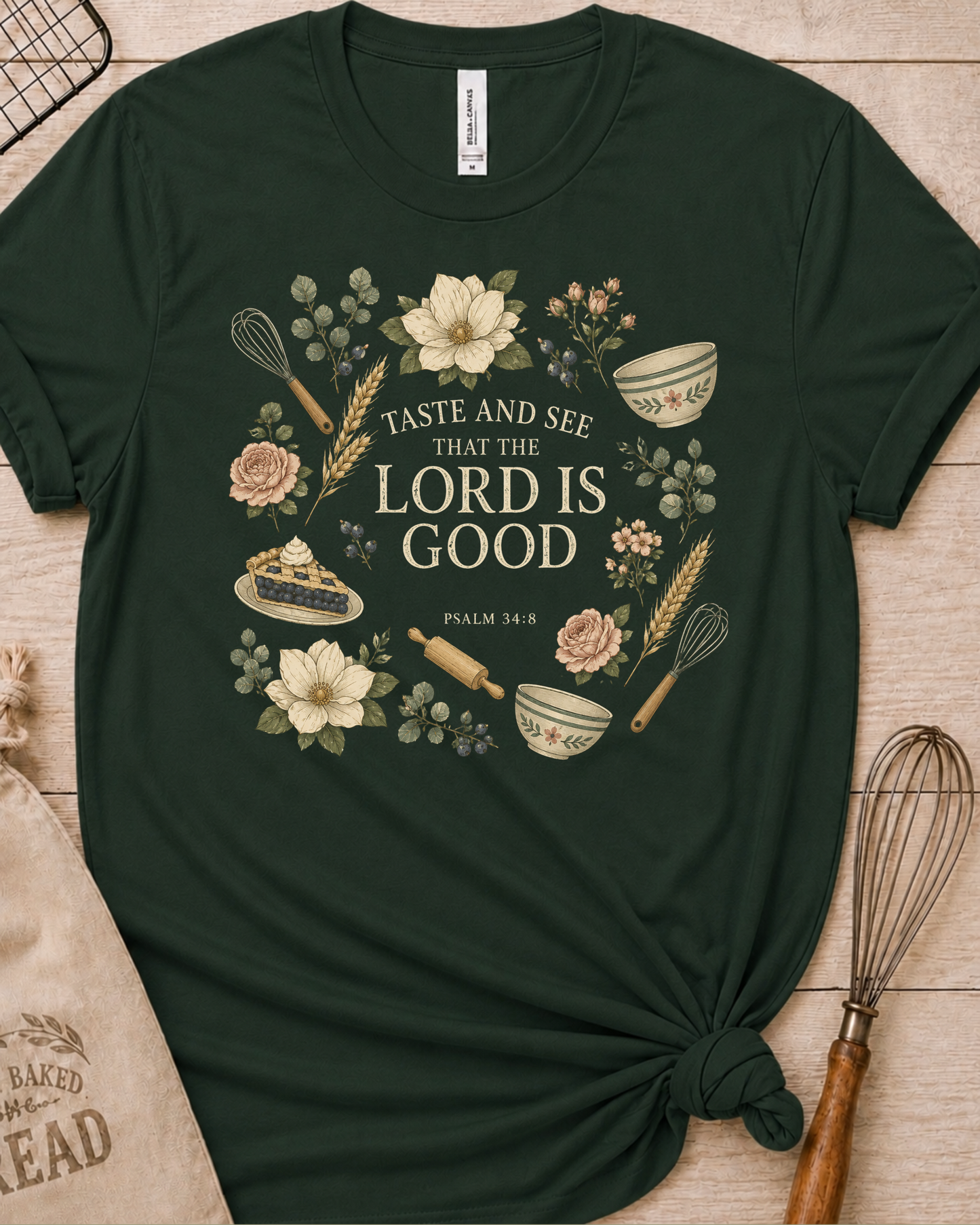Forest green women's relaxed fit t-shirt with Taste and See from Psalm 34:8 inside a soft botanical wreath.