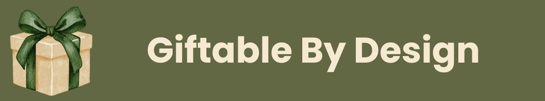 A dark olive green banner featuring a small illustrated gift box with a green bow on the left and the text 'giftable by design' in a light cream font on the right.