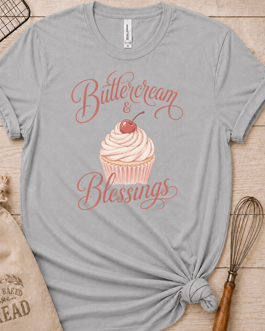 Heather grey women's relaxed fit t-shirt reading Buttercream and Blessings with a frosted cupcake illustration.