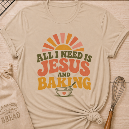 Heather Stone All I Need Is Jesus and Baking women's relaxed fit tee with bold retro lettering, a rising sun, mixing bowl, and whisk