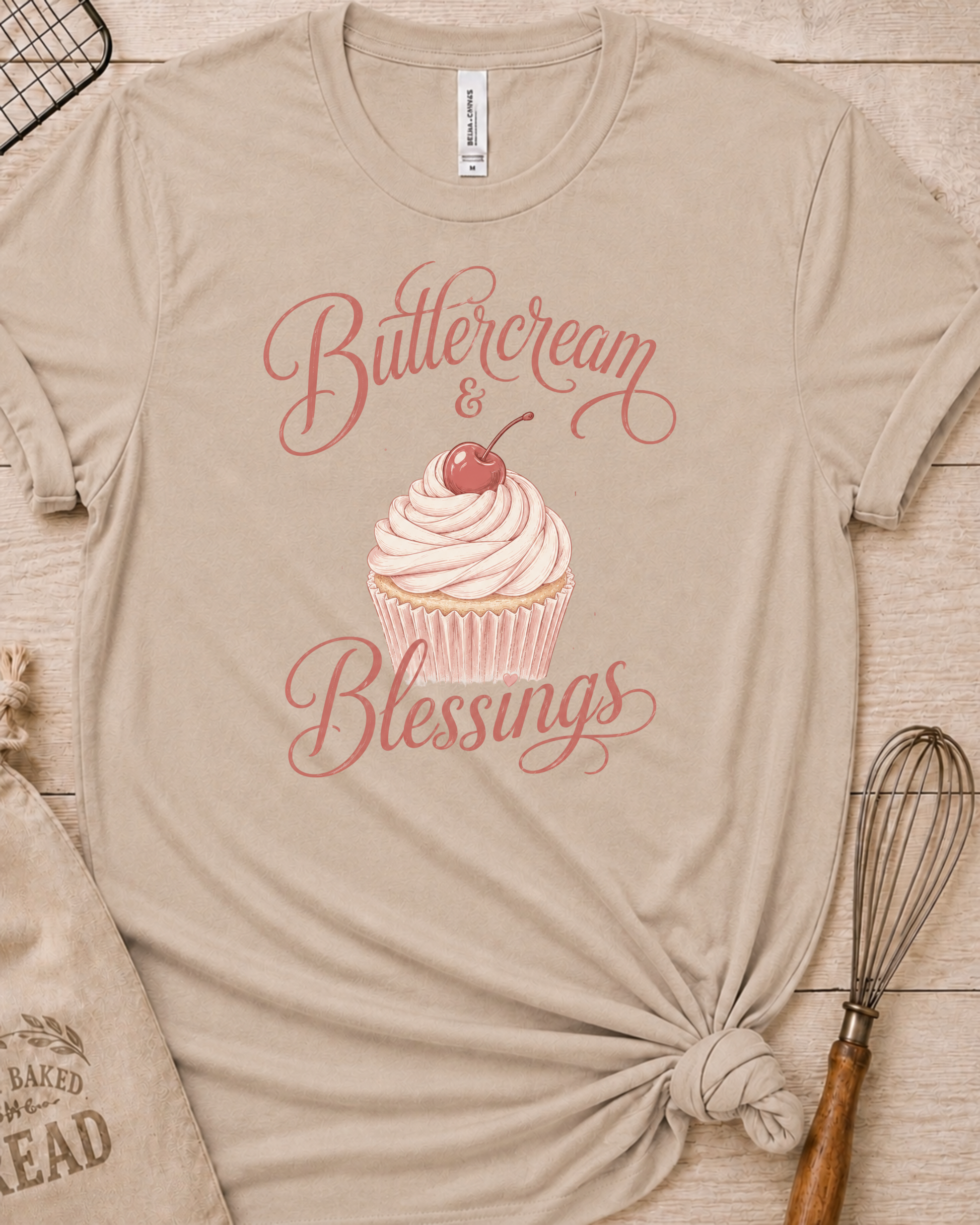 Heather stone women's relaxed fit t-shirt reading Buttercream and Blessings with a frosted cupcake illustration.