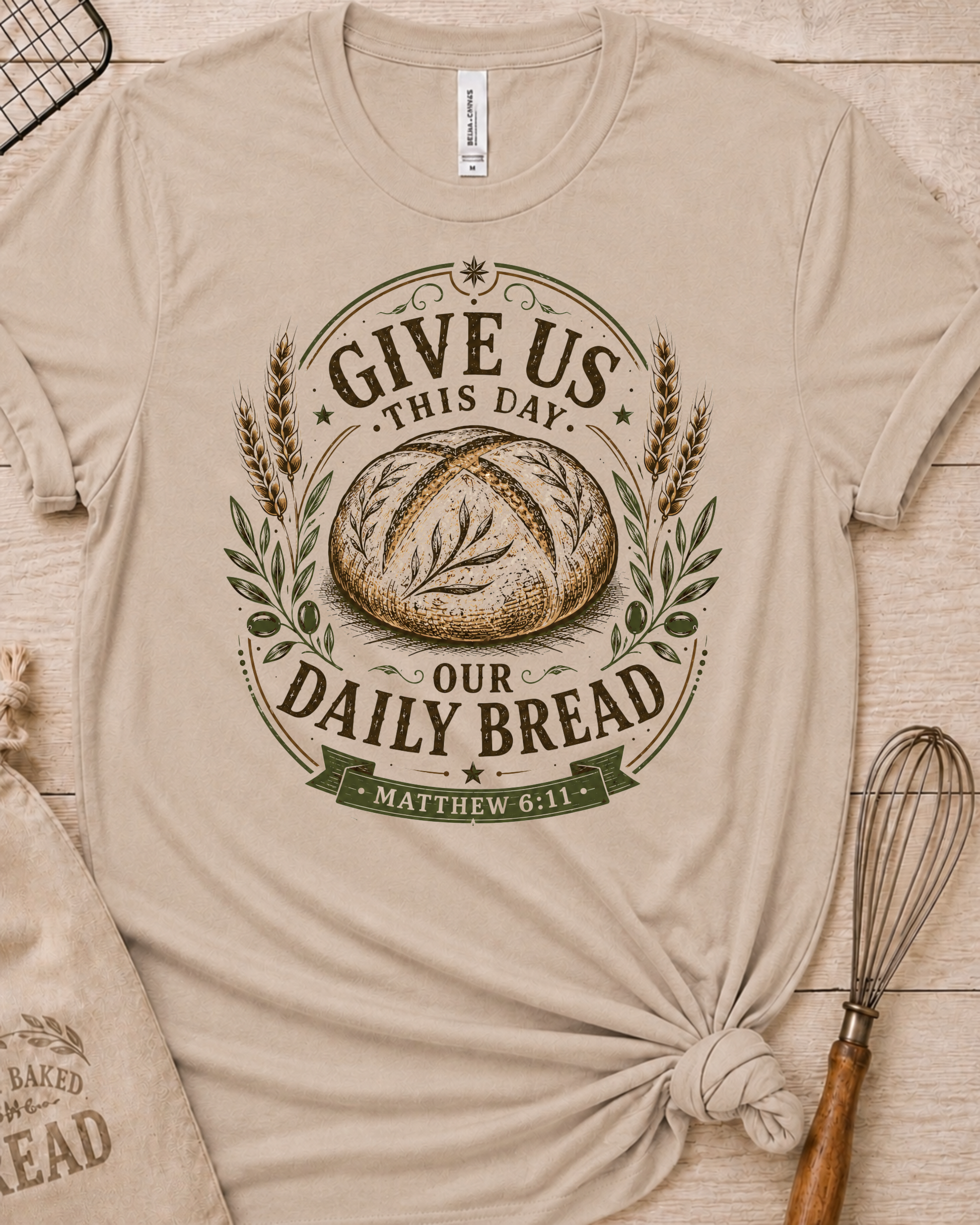 Heather stone women's relaxed fit t-shirt with the Daily Bread emblem, a clean badge-style bread illustration inspired by Matthew 6:11.