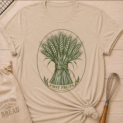 Heather Stone women's relaxed fit tee with a detailed bundle of wheat tied by hand and framed in a classic vintage oval, with First Fruits lettering