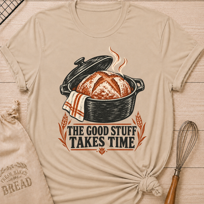 Heather Stone women's relaxed fit tee with a warm artisan loaf rising from a classic Dutch oven with wheat accents and vintage distressed Good Stuff Takes Time lettering